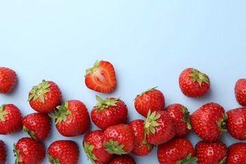 Fresh ripe strawberries on light background, flat lay. Space for text