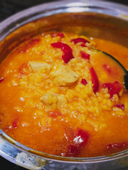 Typical spanish paella. Rice with broth, chicken and vegetables.