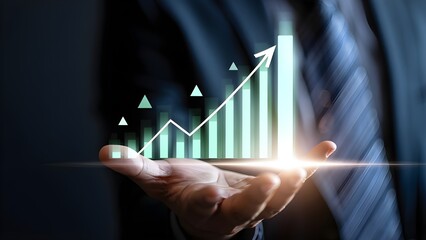 Businessman holding a glowing upward trending financial graph with arrow and bars