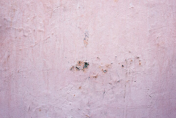 Texture of an old and dirty light pink wall. Background for work.