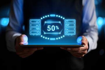 Person holding tablet displaying glowing blue infographic with servers and 50 percent progress