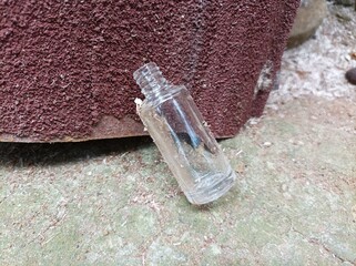 A used glass bottle with a small size..