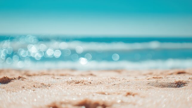 Sandy beach meets a serene turquoise sea, sunlight creating shimmering reflections on the water's surface for a relaxing summer vacation vibe.