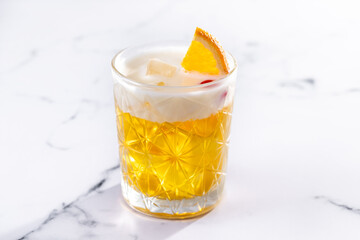 Classic cocktail whiskey sour on white marble background