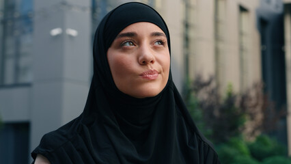 Portrait worried hesitate unsure pensive Muslim positive Islamic woman wearing hijab businesswoman...