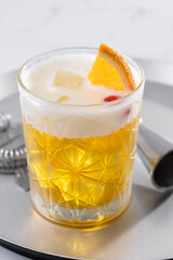 Classic cocktail whiskey sour on white marble background