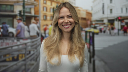 Fototapeta premium Blonde caucasian woman blowing kiss with hand to lips in crowded city street; affection greeting warmth joy.
