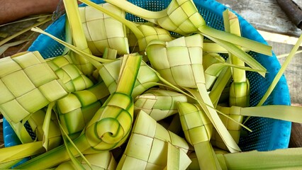 Ketupat is a typical Indonesian food made from rice wrapped in woven young coconut leaves (janur)...