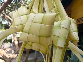 Ketupat is a typical Indonesian food made from rice wrapped in woven young coconut leaves (janur)...