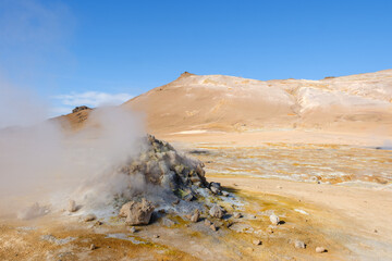 Discover geothermal wonders in Icelands stunning landscape under a clear blue sky