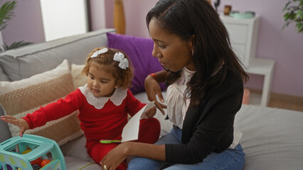 Mother and daughter playing together in a cozy living room, showcasing family love and warmth in a modern home environment.