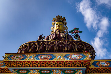 Obraz premium The beautiful and world's tallest statue of Chenrezig in the Pelling, West Sikkim, India. View of A Huge metallic statue of Chenrezig at Sangha Choeling.