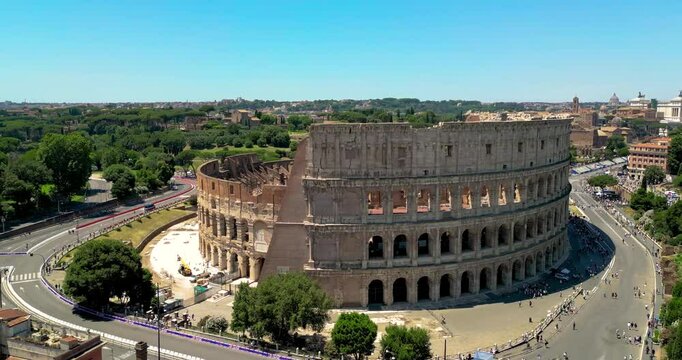 4K Aerial Footage of the Colosseum in Rome During the Day with Clear Views of Ancient Architecture and Historic City Surroundings