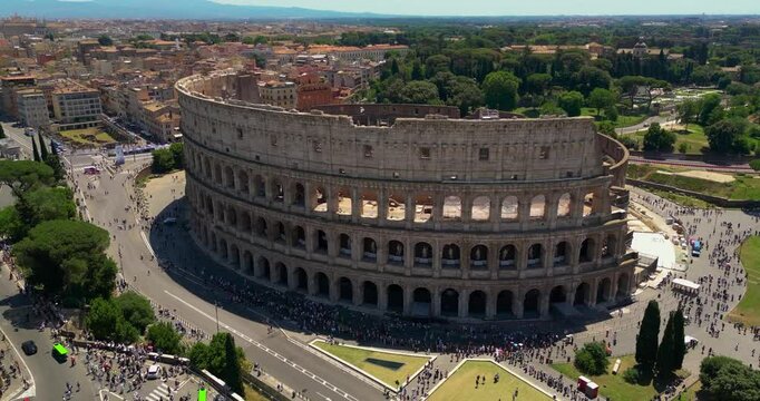 4K Aerial Footage of the Colosseum in Rome During the Day with Clear Views of Ancient Architecture and Historic City Surroundings