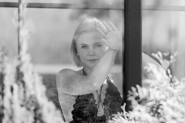Pensive Woman Behind Window – Thoughtful Sad Portrait in Soft Natural Light