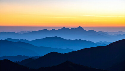 Obraz premium Serene Sunrise Over Majestic Mountain Range with Soft Color Palette