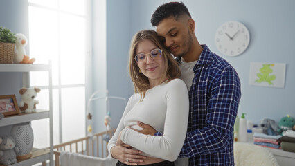 Fototapeta premium Man and woman embracing lovingly in cozy bedroom with cradle, showcasing anticipation of new family addition, surrounded by soft toys on a sunny day.