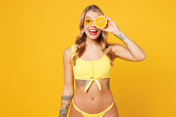 Young beautiful sexy woman wears bikini swimsuit rest near hotel pool hold in hand cover eye with...