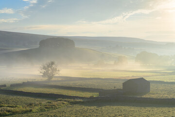 Yorkshire barn with beautiful misty background taken near Hawes, UK.