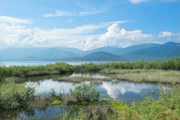 Spectacular Bafa Lake view in sunny and cloudy weather. Reflections in Bafa Lake. View of Bafa Lake Nature Park in T&uuml;rkiye.