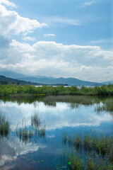 Spectacular Bafa Lake view in sunny and cloudy weather. Reflections in Bafa Lake. View of Bafa Lake Nature Park in Türkiye.