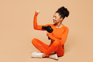 Full body young happy fitness trainer instructor sporty woman sportsman wear orange clothes spend...