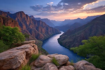 Majestic river weaving through rugged canyon terrain under a dramatic sky capturing the essence of natural beauty and the serenity of untouched wilderness captured with clarity