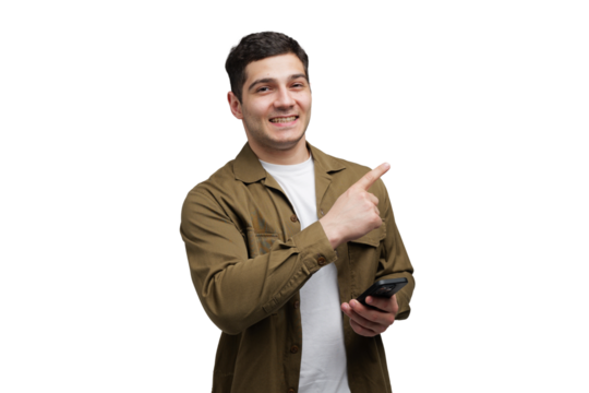 Smiling man pointing with enthusiasm while holding a smartphone against a clean, bright background in a casual setting