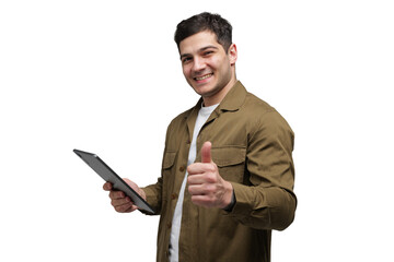 Enthusiastic young man gives a thumbs up while holding a tablet, showcasing positivity and...