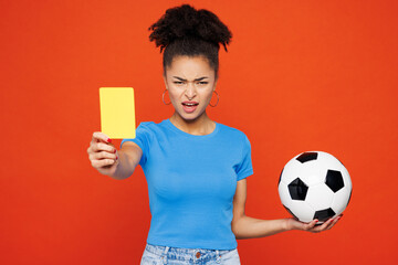 Young woman fan wear basic blue t-shirt cheer up support football sport team hold yellow card...