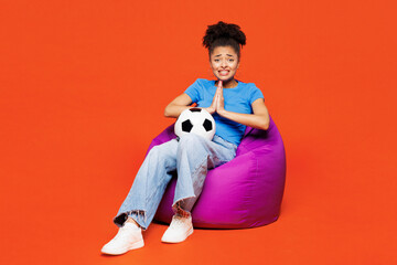 Full body young woman fan in blue clothes cheer up support football sport team hold soccer ball...