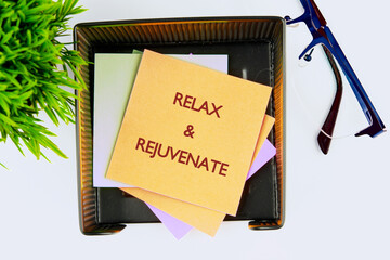 The conceptual phrase RELAX AND REJUVENATE. The concept of beauty and health. concept Relax,...