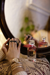 a girl's hands picking up a product to apply make-up