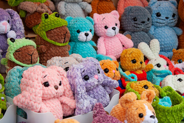 New soft knitted toys, hand made from yarn.