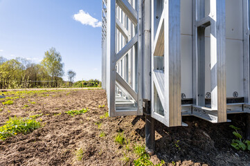 Pile foundation. Pile support of an apartment building. Modern frame house on stilts. The...