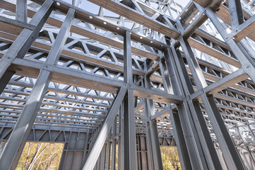 Steel frame commercial building under construction. The steel girder framework of a new building