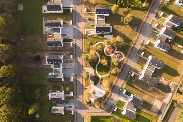 Aerial top-down view of a modern residential neighborhood with a park and playground
