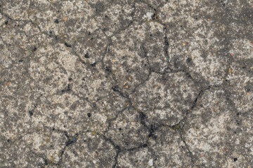 Old gray cracked concrete screed close up