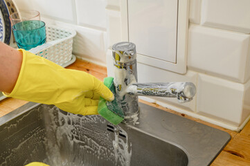 Scrub clean sink with baking soda and vinegar, clean house