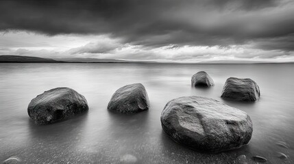 Smooth stones rest on a tranquil lake.