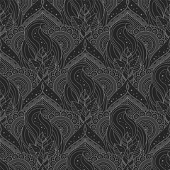Ethnic seamless pattern in white and black colors with leaves and abstract designs. Floral and abstract decorations, oriental, indian and asian motifs.