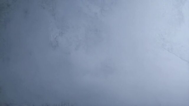 Line of colorful sharpened drawing pencils against a grey background with copy space for text or design layouts.