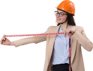 Girl engineer in an orange construction helmet with a measuring tape in her hands on a white...