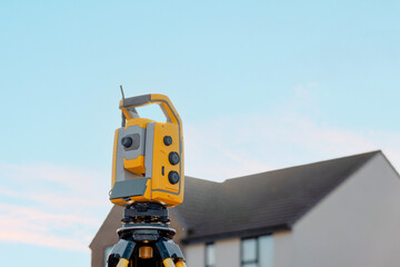 Close-up of Construction site with surveying equipment theodolite total station highlighting the...