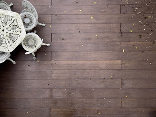 Vintage White Table and Chairs on Wooden Terrace with Fallen Leaves