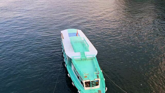 Local charter boats for inter-island crossings on Lake Toba carrying tourists, passengers and cargo. The ship travels from Parapat to the island of Samosir.