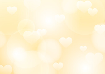 優しい黄色とオレンジのグラデーションに浮かぶハートの背景