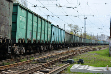 Heavy industry, heavy freight railway loading metal wagons pass along the gauges, railway lines.