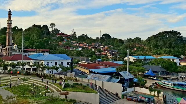 The landscape of the Bebas beach area on the outskirts of Lake Toba with a natural feel is filled with residential housing in the area of the largest volcanic lake