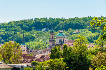 A view from the castle gardens towards buildings on the west bank of the Vltava river in Prague in...